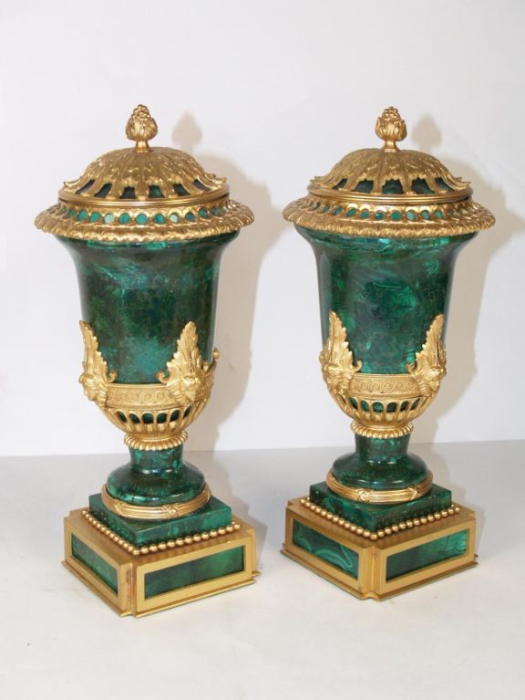 PAIR OF LOUIS XVI STYLE MALACHITE & ORMOLU
CASSOLETTES, CONTINENTAL, EACH EMBELLISH
WITH VARIOUS ORMOLU MOUNTS  ON A SQUARE BASE.  TOPS HAVE BEEN SECURED

Originally $ 9,500.00

 Malachite is a copper carbonate mineral, with the formula