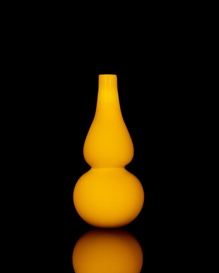 Of rich egg-yolk yellow color, the bottle, forming a double gourd with a flat base and an elongated neck. The bottle was probably intended to be used as water-dropper by a scholar.

Provenance: 
Shakris, San Francisco, CA
Property from the