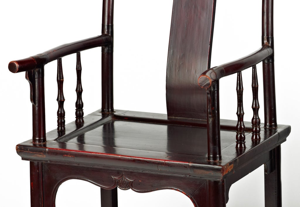 A pair of yoke-back armchairs