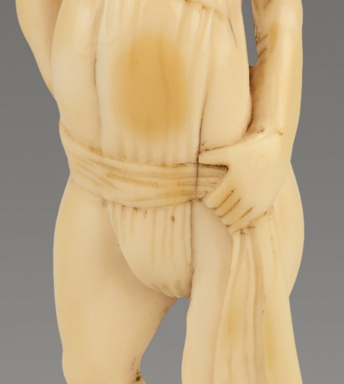 Carved A Humorous Ivory Netsuke Of A Man Tying His Loin Cloth
