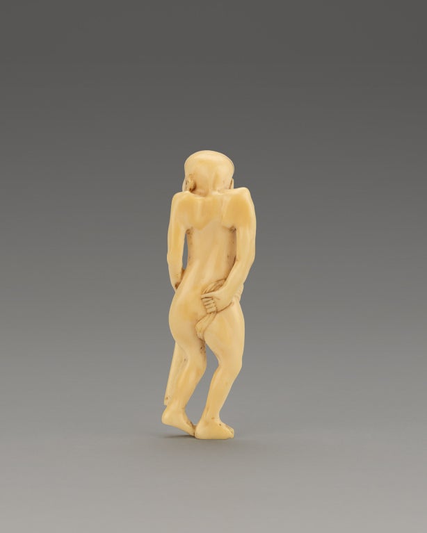 A Humorous Ivory Netsuke Of A Man Tying His Loin Cloth In Excellent Condition In Winter Park, FL