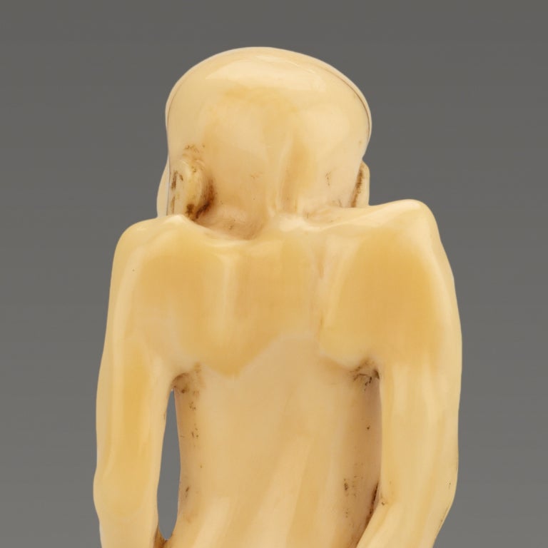 19th Century A Humorous Ivory Netsuke Of A Man Tying His Loin Cloth