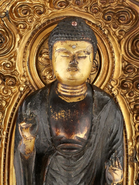A gilt lacquered wood figure of Buddha
