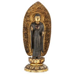 A gilt lacquered wood figure of Buddha
