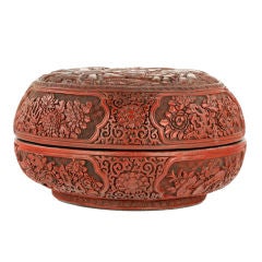 A carved cinnabar lacquer circular box and cover