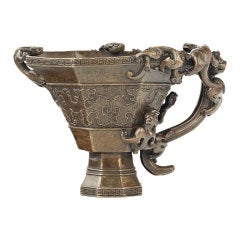 A rhinoceros horn-shape bronze cup