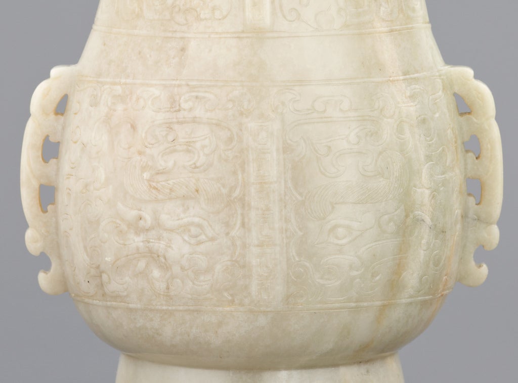 18th Century and Earlier An archaistic jade vase and cover