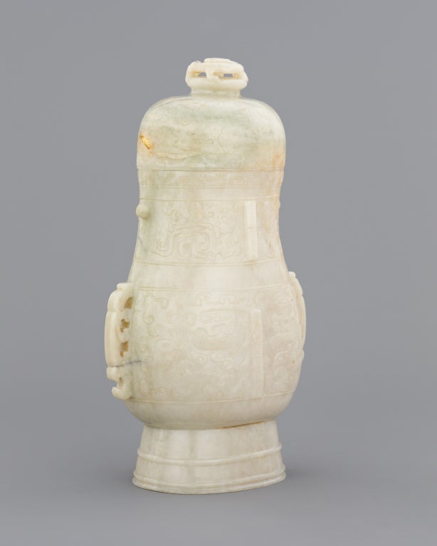 An archaistic jade vase and cover 1