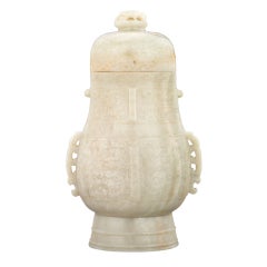 An archaistic jade vase and cover