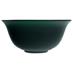 A large emerald green glass bowl