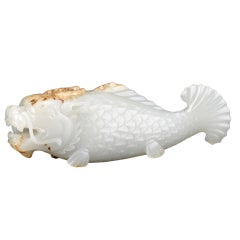 A white jade carving of a “fish-dragon”