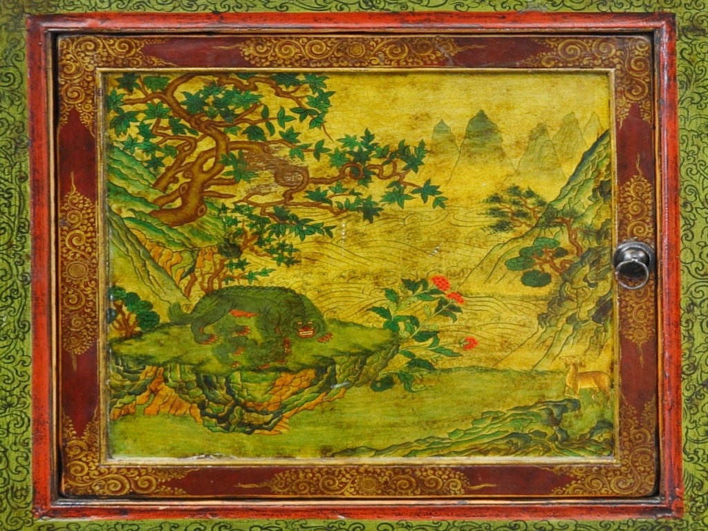 A hand painted Tibetan buffet-style cabinet with three removable doors painted with an outdoor scene, below, three pullout draws also painted with the same style.  Inside has two shelves; the top shelf removable.