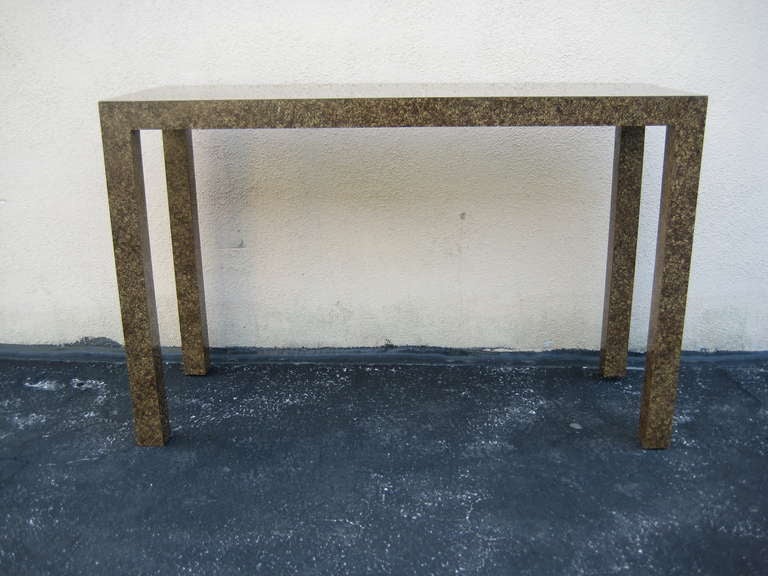 Midcentury tortious like design or sometimes referred to as oil drop design. Shades of brown / gold. Multipurpose parsons table.