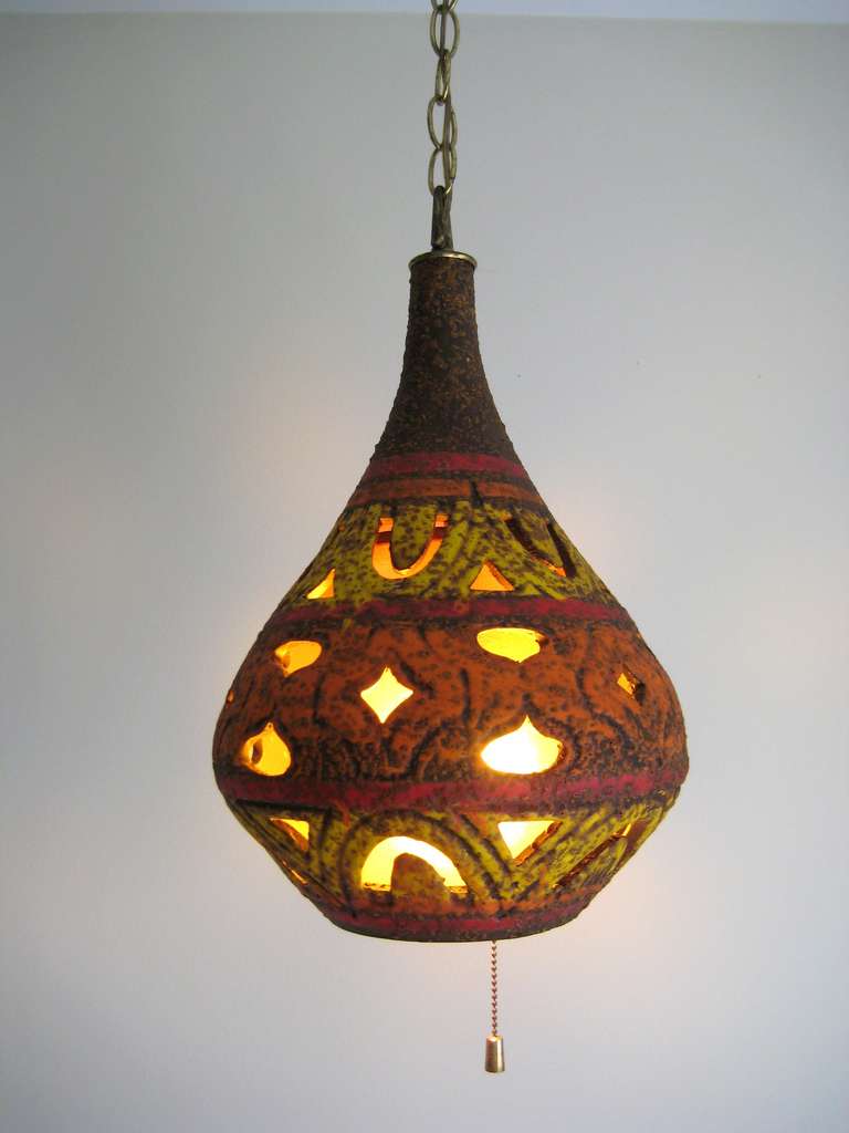 1960s Mid Century Glazed pottery / ceramic cut-out hanging lamp with pull switch. 
Height 18 inch x Width 9 inches