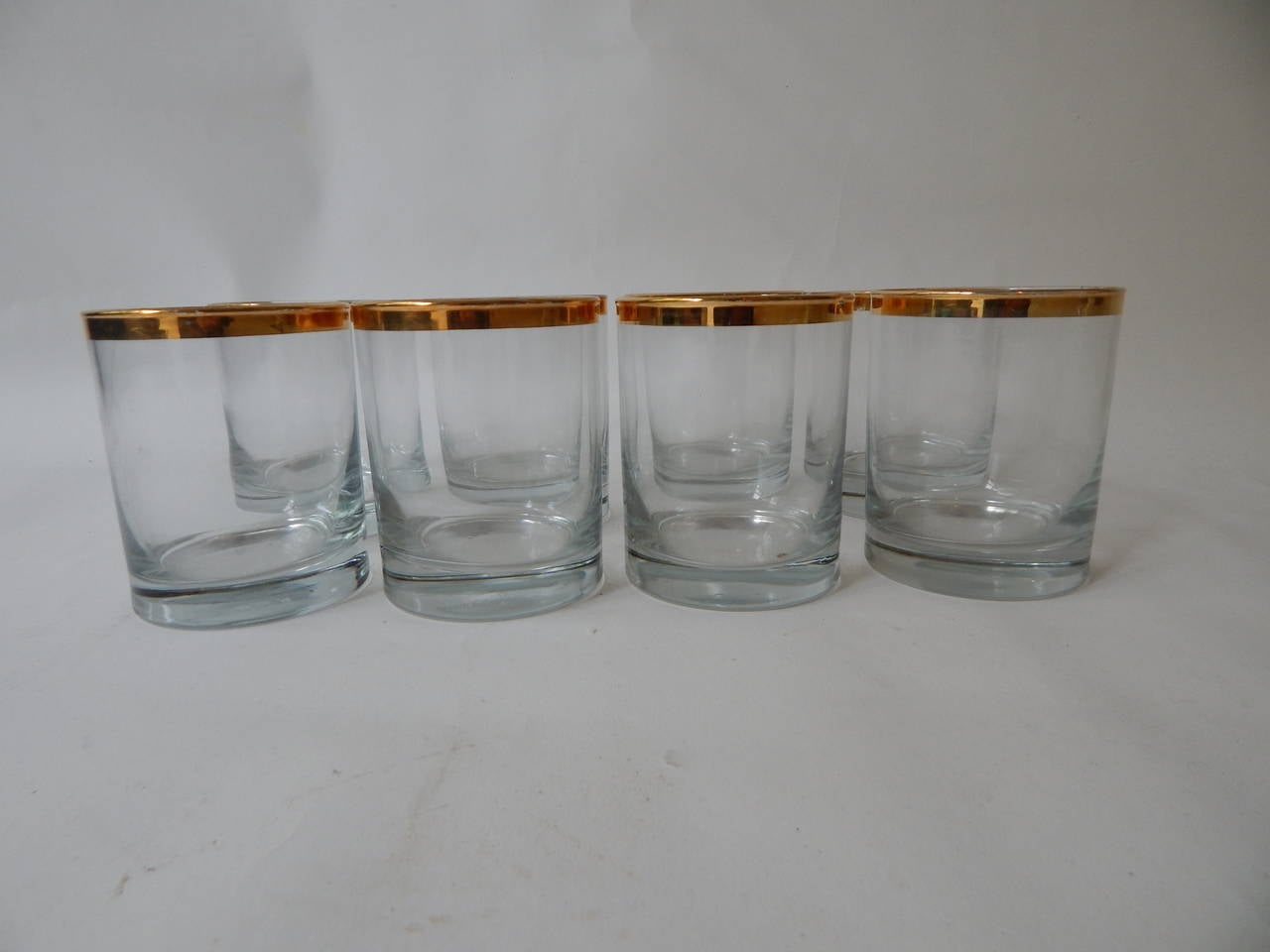 22k gold rimmed glasses designed by Dorothy Thorpe. Marking on bottom of each glass.
