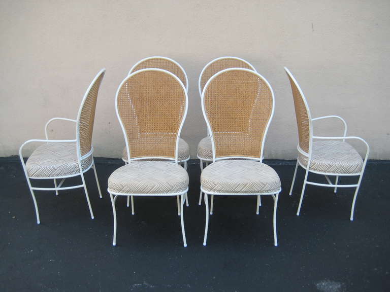 Fabulous and Rather Rare Milo Baughman for Thayer Coggin Dated 1976. Complete Set of six dining chairs. Includes Two Arm Chairs and four Side Chairs. Off White/ White Enameled or Laquer Wrought Iron  Metal with Cane Back. Upholstered seats. Original