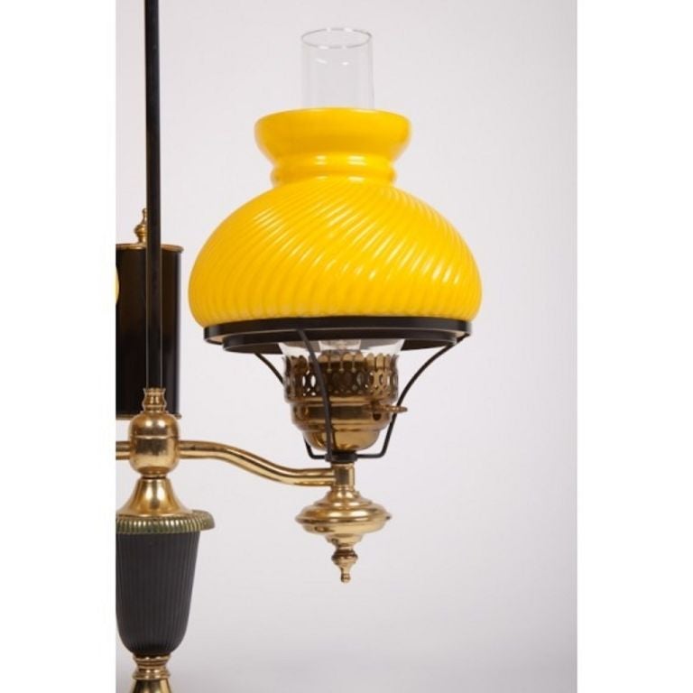 Brass with bright yellow glass shades. Marble base.