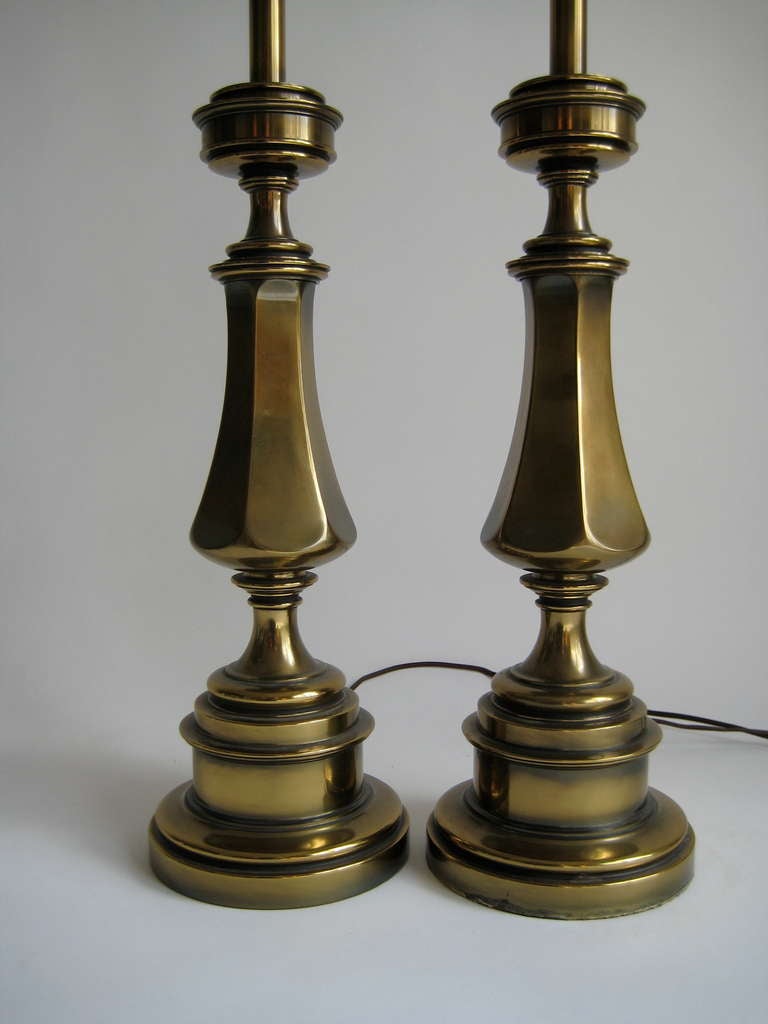 Mid-Century pair of large brass table lamps marked Stiffel. Stiffel made two sizes in this lamp design. These are the larger size. Solid brass and heavy in weight. Height of base from bottom to bulb 28