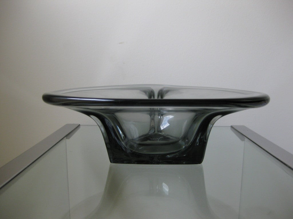Elis Bergh (1981-1954) Originally trained as an architect was the lead designer for Kosta Boda from 1929 - 1950. Artist signed and marked Kosta. Art Deco glass bowl. Gun metal grey smoked glass.