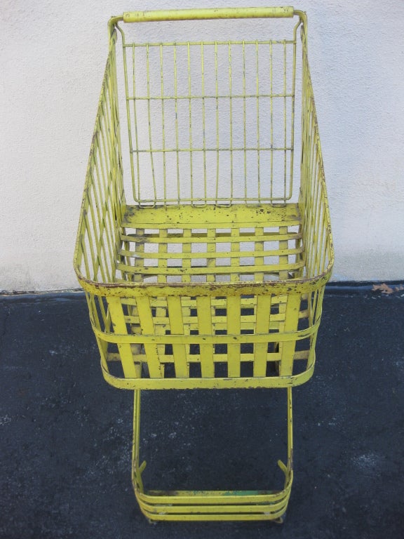 Original vintage Industrial bent steel strap mobile grocery cart, circa 1920s or 1930s. Rolls well and fully functional. Would make an excellent store display piece.