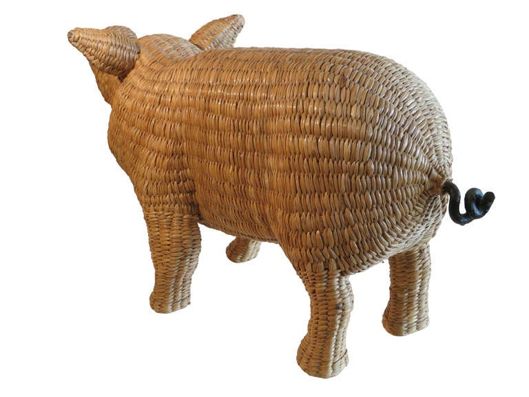 This little piggy was made by Mario Lopez Torres, an esteemed wicker and Iron sculptor from Michoacan, Mexico.
