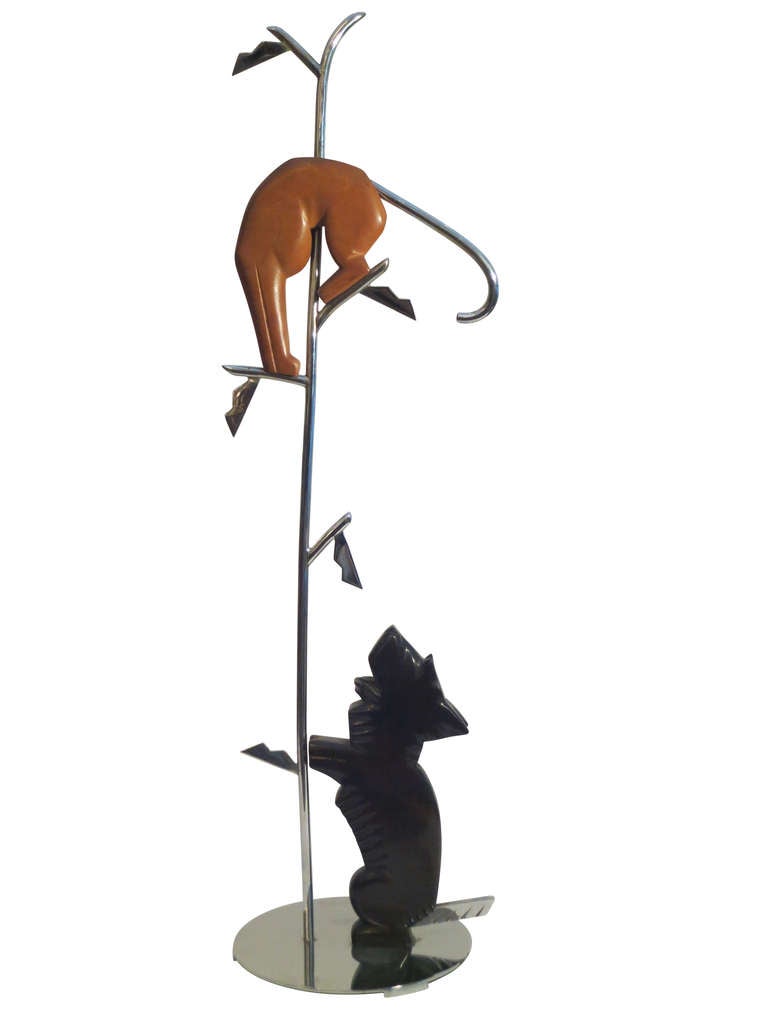 Charming Deco piece made in Austria of chromed metal and wood. The carved scotty dog is ebonized and the cat is carved from a single piece of walnut. Marks: Canelli, Argentor Vienna