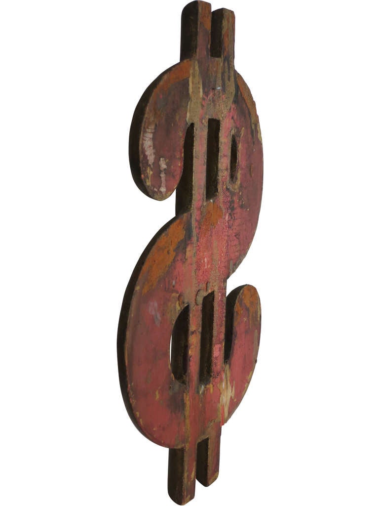 An early 1900s American trade sign with old paint on verso and remnants of gilt on the front.
