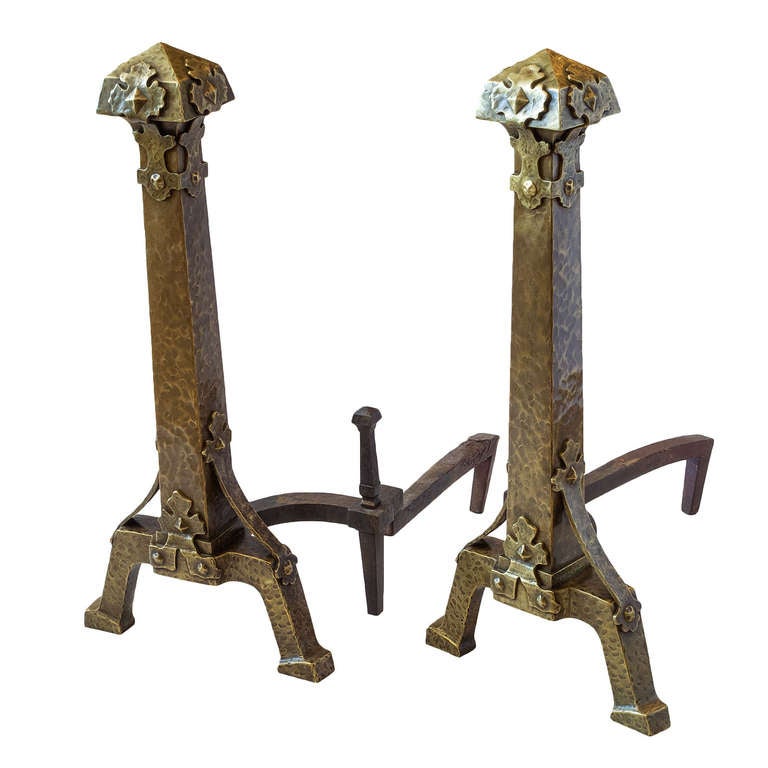 Exceptionally large hammered bronze andirons. Beautiful, overlaid foliate details are attached with custom bronze rivets.
