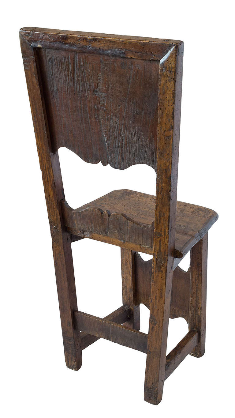 Very early Italian country chair with contrasting inlays in a heart- shaped decoration and in the filigree work.