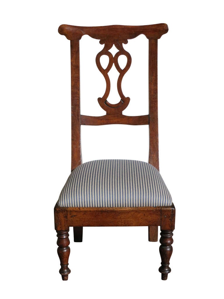 Distinctive American side chair with sculptural lines and an unusual high back.  The seat has been newly covered.