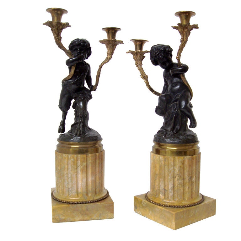 Pair of Putti Candelabra For Sale