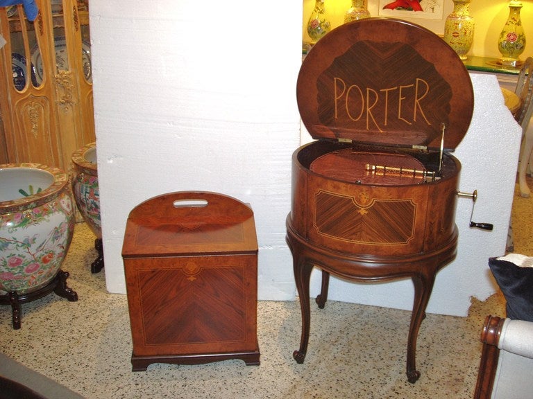 Beautiful Porter music box with separate box for disc storage. Includes hand crank and 27 copper discs