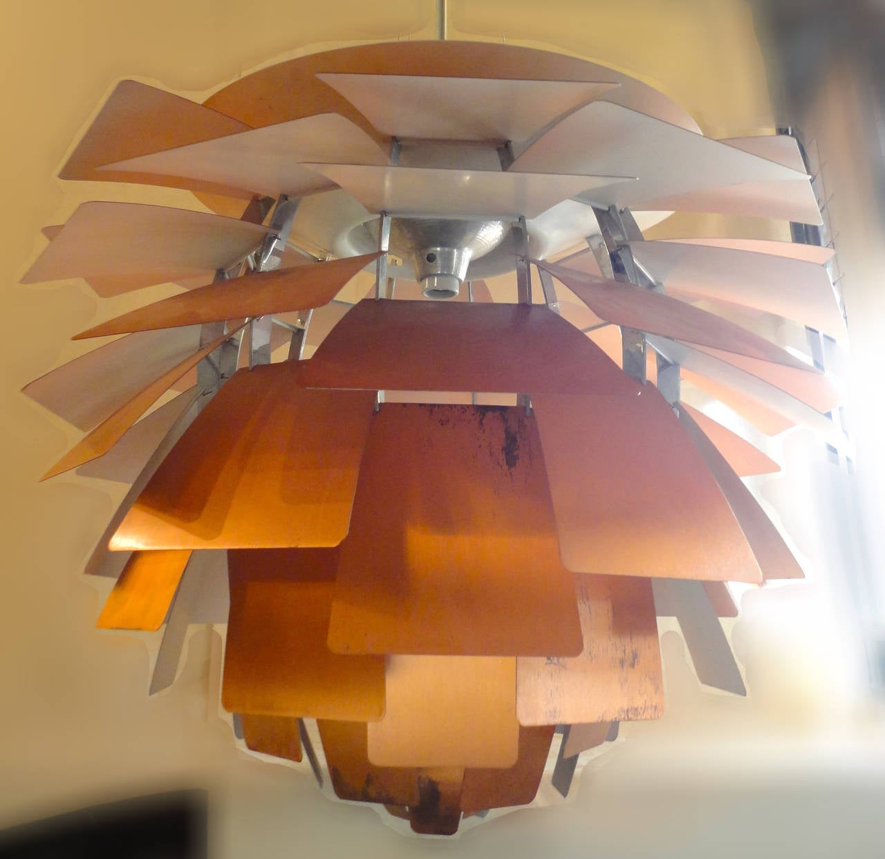 Mid-Century Modern PH chandelier made for Louis Poulsen with rich copper color leaves. A Classic in Mid-Century design by the premier designer in lighting. Made to give an even, diffused light with no major glare.
Height to top of canopy: approx.