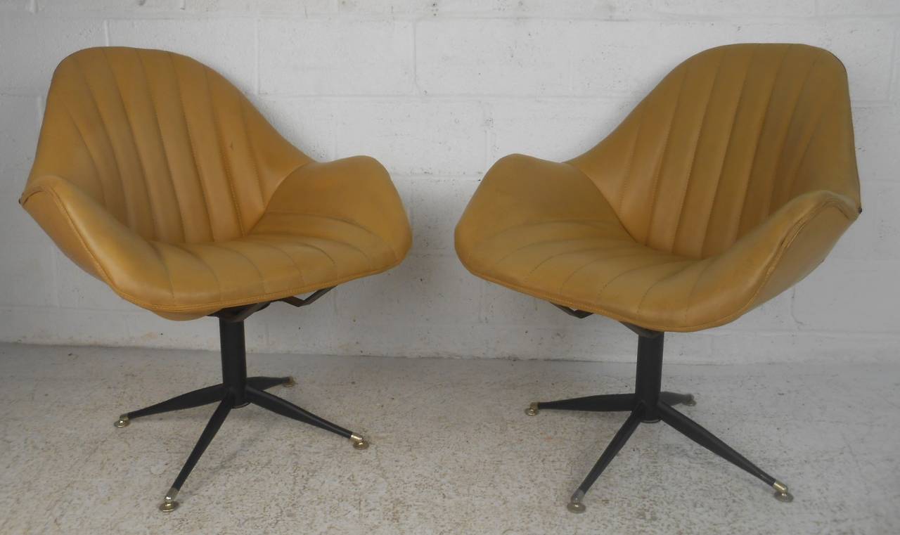 Vinyl upholstered swiveling side chairs. Please confirm item location (NY or NJ) with dealer.