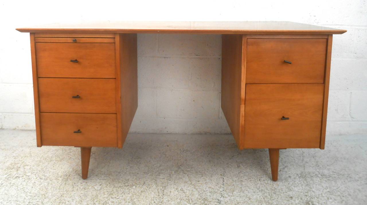 This beautiful Maple desk  features unique vintage drawer pulls, tapered legs, and five drawers for plenty of storage. Unique period piece adds modern style to home or office.
Kneehole: 20"w 23"d 28"h

Please confirm item location