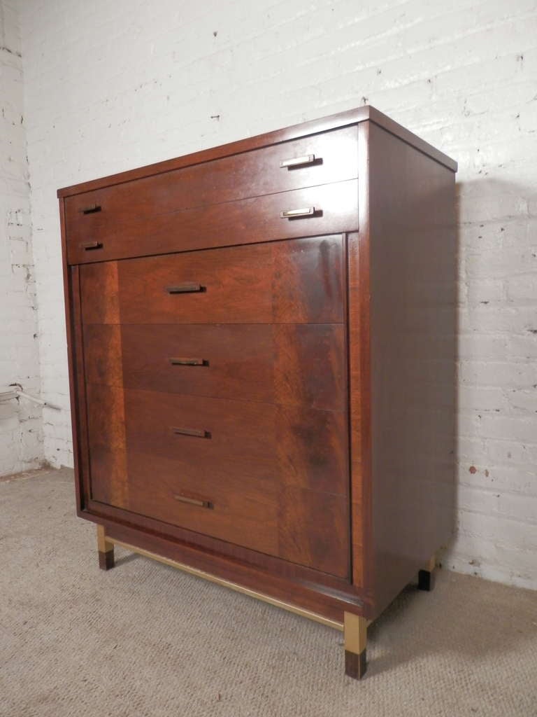 Sixties Era highboy dresser with five wide drawers, accented with lovely burl wood and brass hardware. Quality crafted, fashionable and functional.

(Please confirm item location - NY or NJ - with dealer)