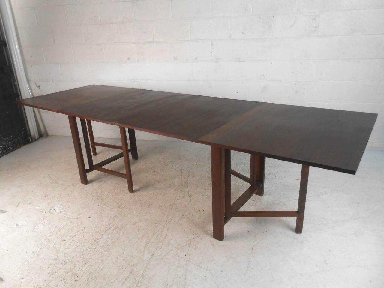 Vintage Danish drop-leaf table with multiple sizes, great for small dining areas. Can open one leaf (33