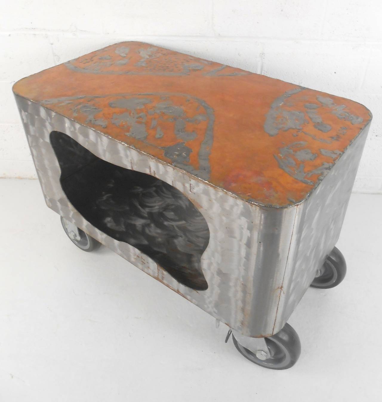 Highly unusual cart with strong industrial style. Copper top distressed finish, ground steel body with ample storage, set on large locking casters.
Very unique and handsome addition to your living room.

(Please confirm item location - NY or NJ -