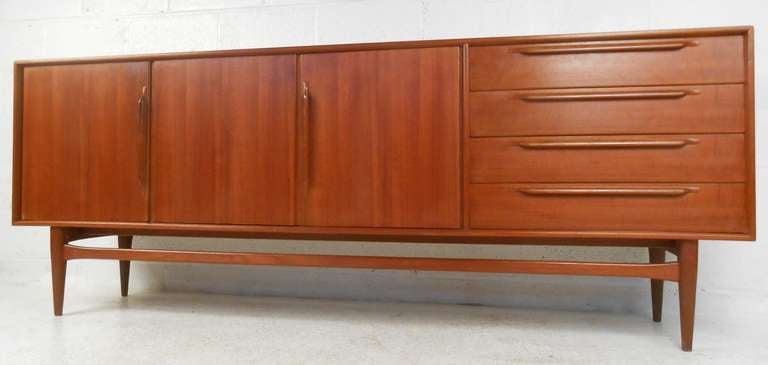 Large teak Danish modern server with beautiful, rich patina and ample storage. Please confirm item location (NY or NJ) with dealer.