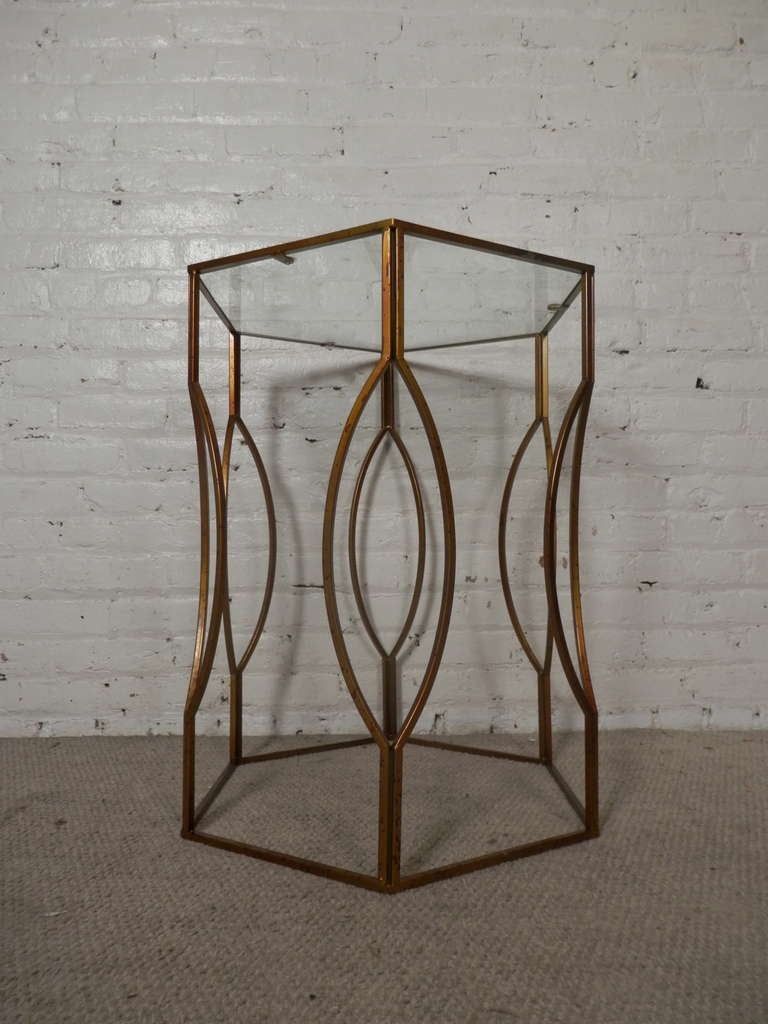 Mastercraft style metal side table with glass top. Unusual shaped metal base, makes for a great sofa side table or garden pedestal.

(Please confirm item location - NY or NJ - with dealer)