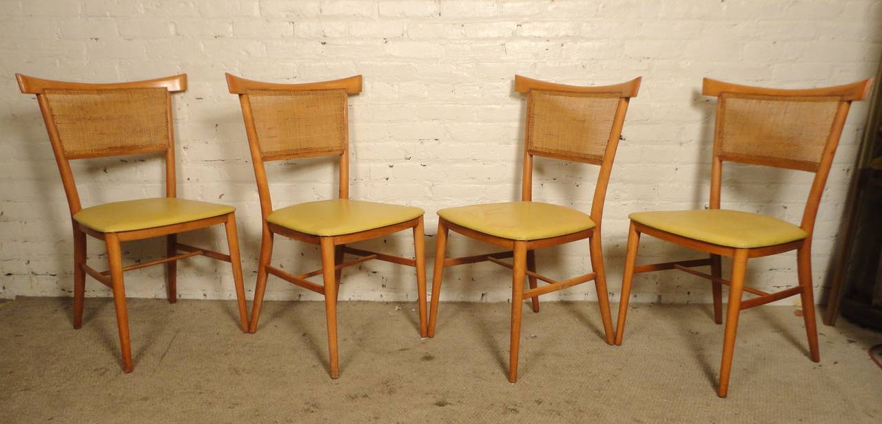 Set of four Mid-Century Modern dining chairs by Paul McCobb for his Perimeter Group. Maple frames, cane back, sculpted bow tie style back. Nice tapered legs.

(Please confirm item location NY or NJ with dealer).