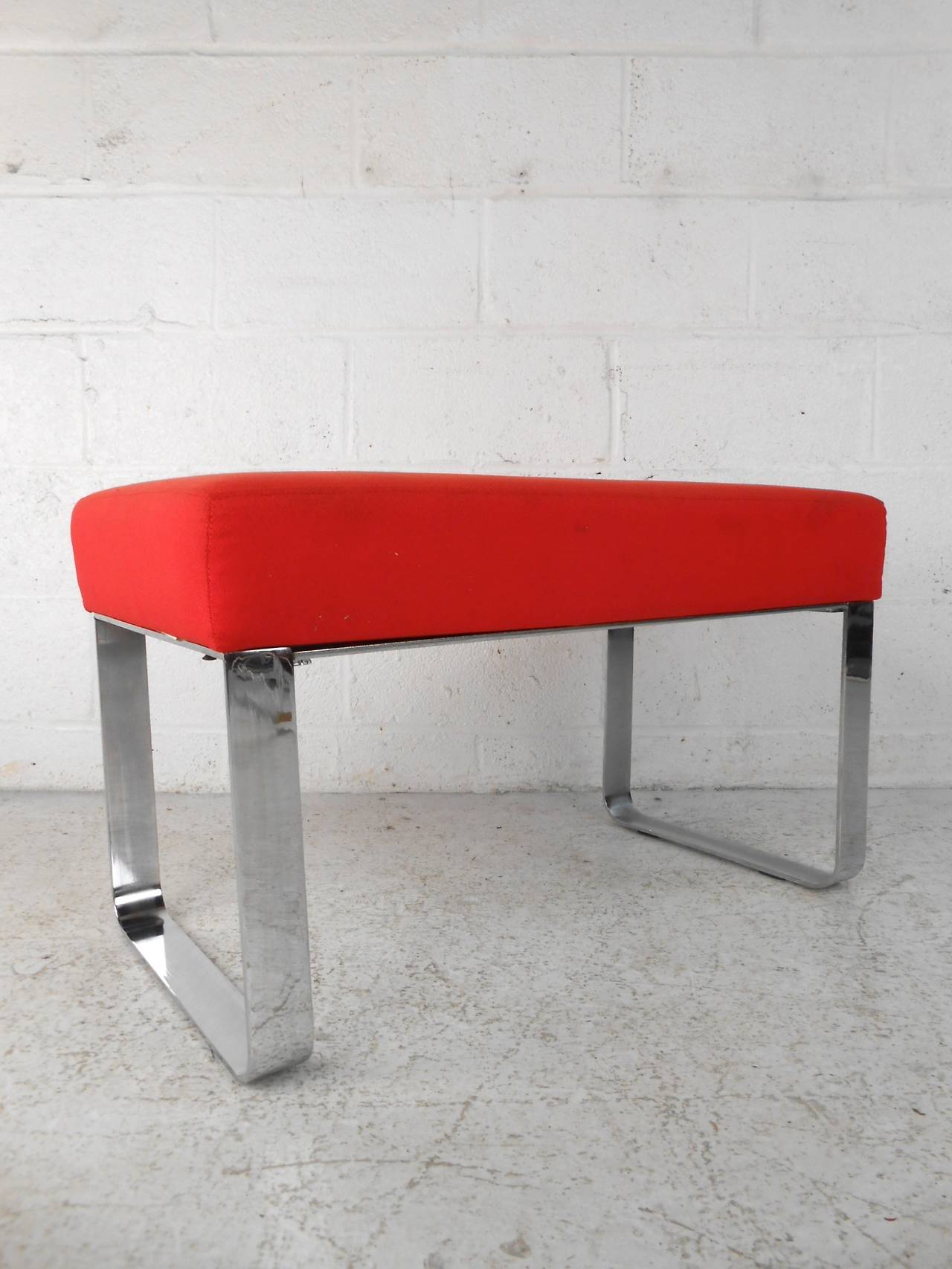 This mid-century modern ottoman features bright red upholstery with a sturdy chrome base that offer comfortable occasional seating to any home or office space.

Please confirm item location (NY or NJ) with dealer.