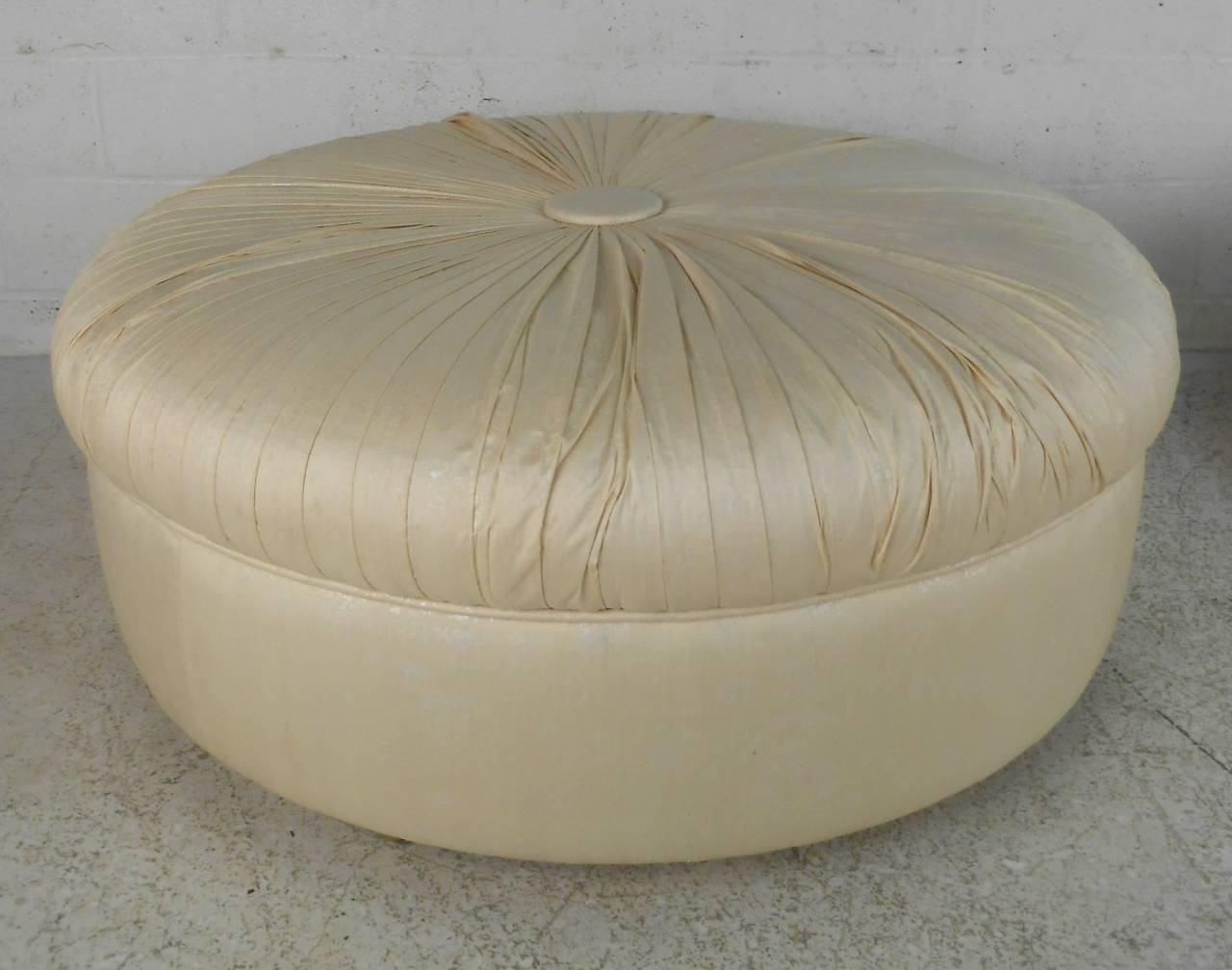 This listing is for a vintage ottoman, perfect for occasional seating or accent in any modern application. Unique design and size makes this a great find! Two available (one on wheels, one on rubber feet), however given price is for one. Contact for