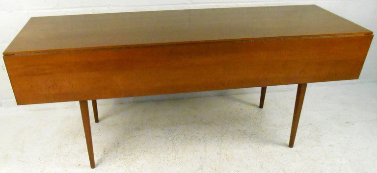 This Walnut drop leaf table is uniquely sized and an extremely versatile dining or work surface. 

Please confirm item location (NY or NJ) with dealer.