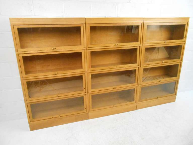 Vintage Hale 800 series stacking bookcases with glass doors in solid birch. Please confirm item location (NY or NJ) with dealer.