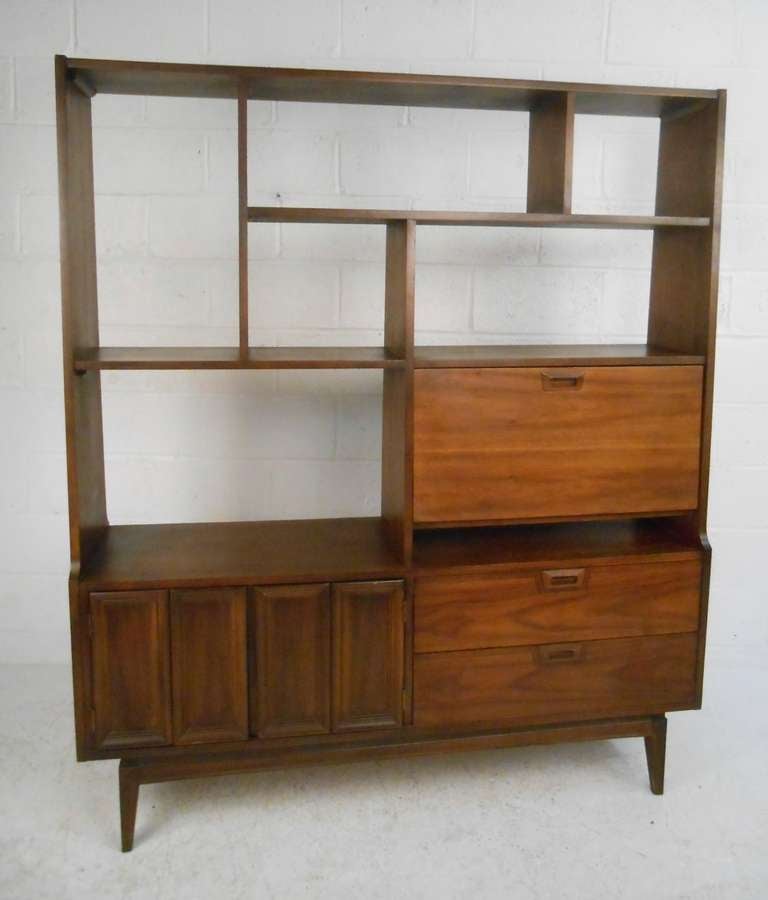 Vintage walnut bookcase with drop down secretary and storage below. Please confirm item location (NY or NJ) with dealer.