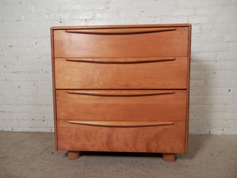 Very odd chest of drawers in champagne finish with an unusual drop front drawer that pulls out for writing and storage purposes. Lovely Wakefield style curved edges and 