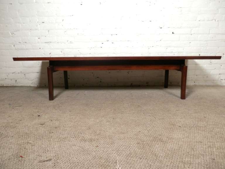 Vintage modern long table in rich walnut grain. Simple and sleek design, similar to the 