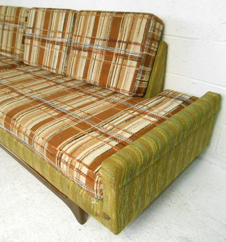 This 1970s, sectional sofa by Prestige Furniture features Pearsall style legs, and a truly unique design. Sculpted base and vintage fabric make a funky retro statement in any modern setting.

 Please confirm item location (NY or NJ) with dealer.
 