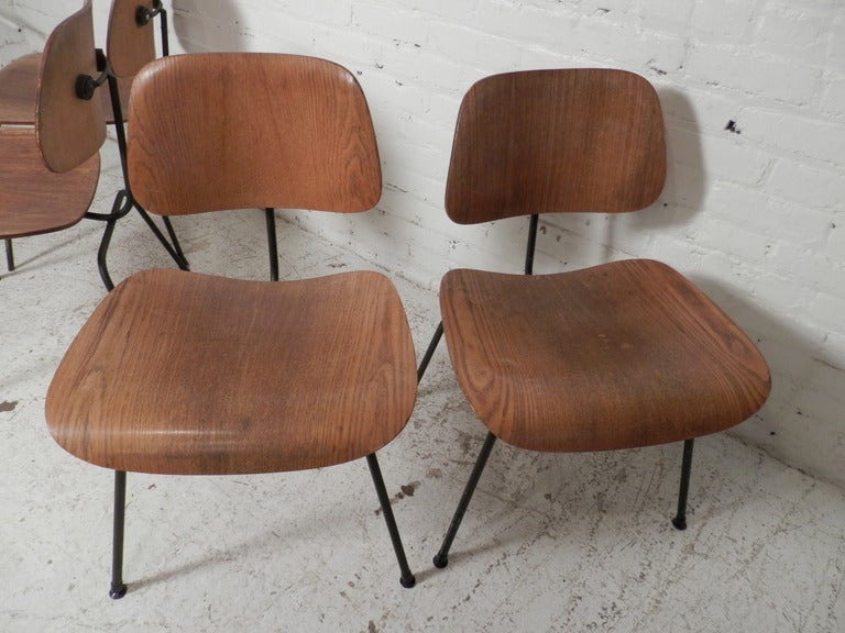 Classic vintage modern chairs designed by Charles and Ray Eames and made by Herman Miller. Labeled DCM (Dining Chair Metal) with bentwood seat and back with iron frames.

Can be re-finished in a Semi-Gloss, French Polish, or Black (Piano)